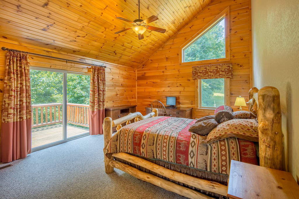 Stone fireplace and timber details inside Smoky Mountain Dream luxury cabin