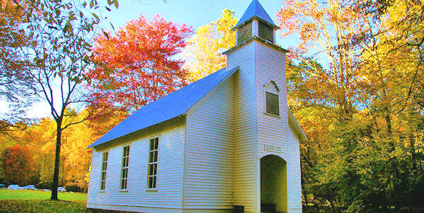 Palmer Chapel surrounded by open fields in Cataloochee Valley