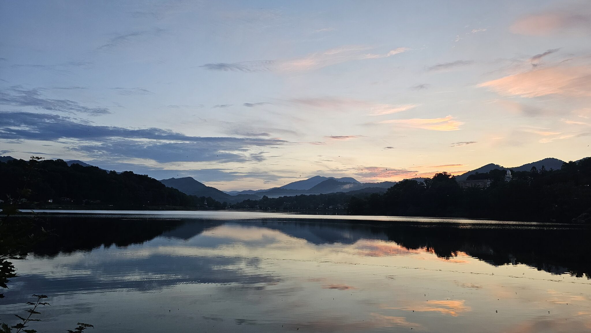 Sunset over Lake Junaluska with mountain silhouettes