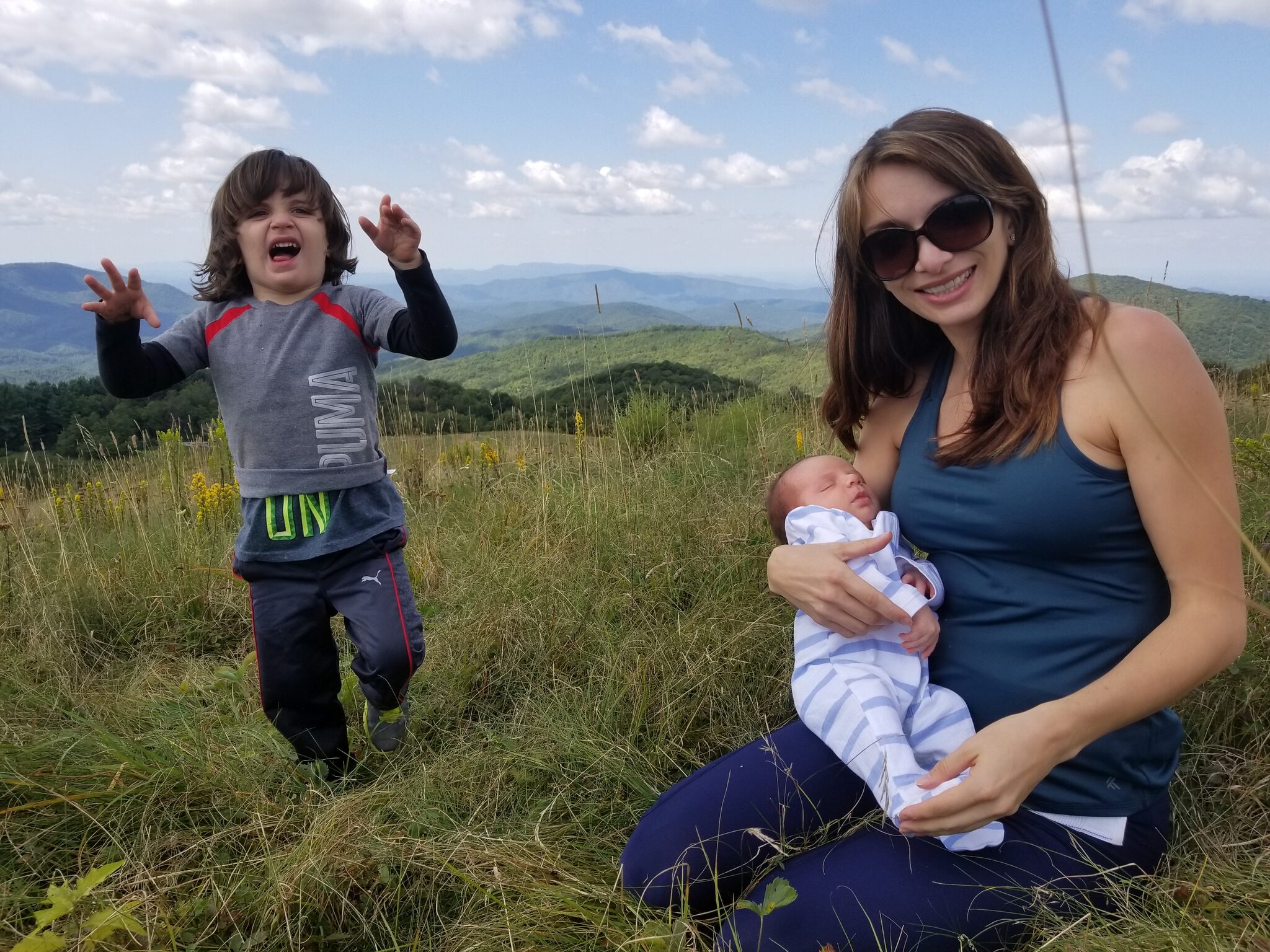 Family enjoying a sunny day on the Max Patch bald summit