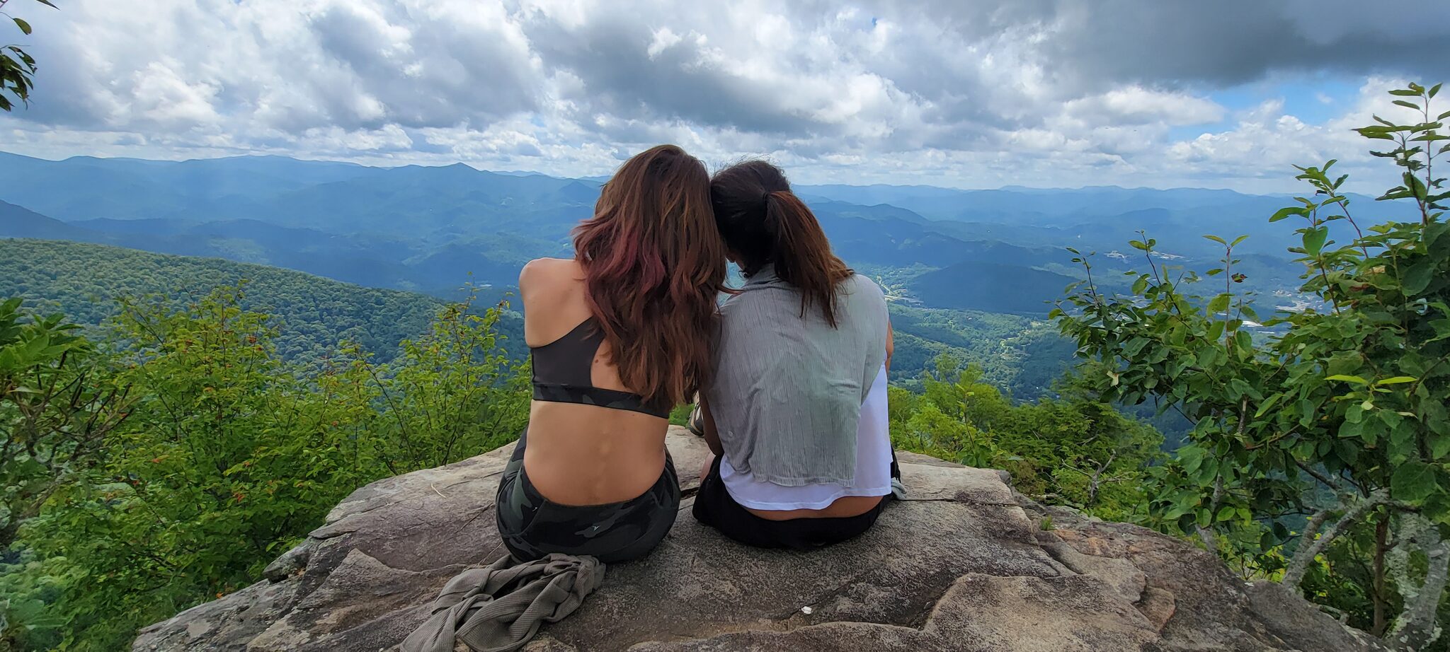 Two hikers enjoying the valley overlook from The Pinnacle summit
