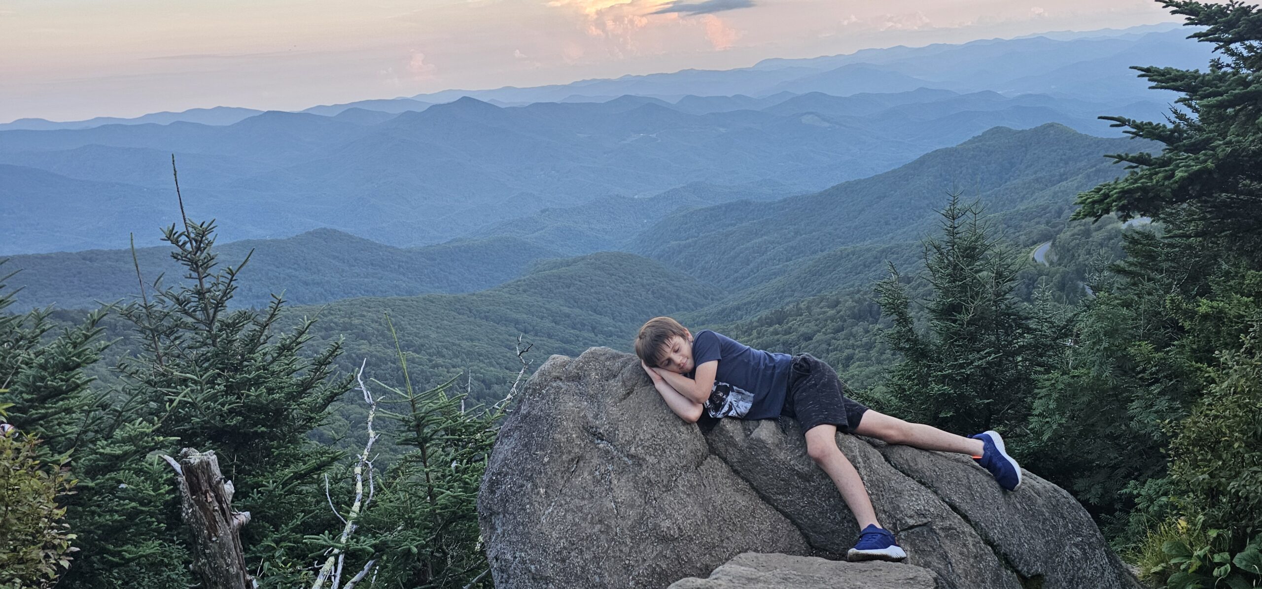 Sunset at Waterrock Knob summit with misty Blue Ridge Mountain views